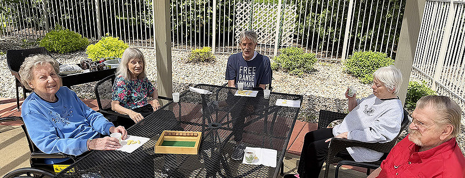 Pine Villa folks enjoy games out on the patio